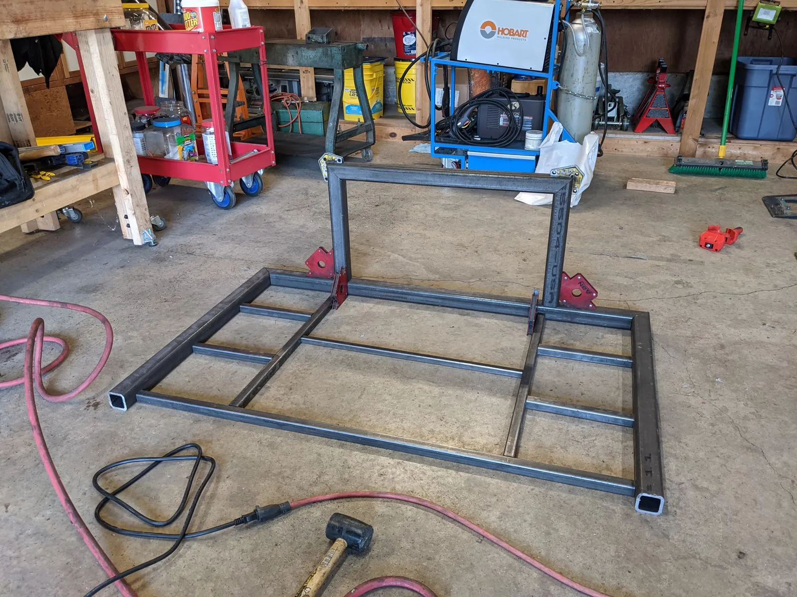 Frame tubes cut and laid out on the shop floor