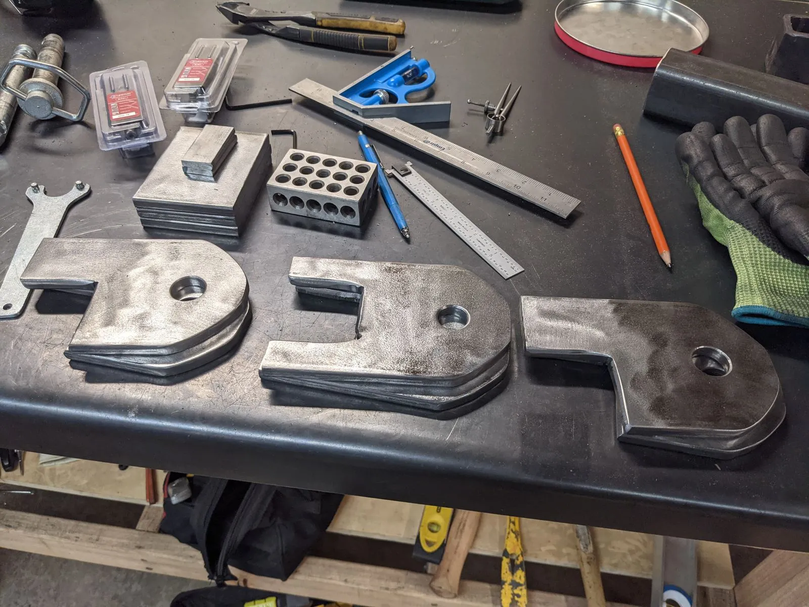 Three-point mount brackets plasma cut from thick hot roll steel
