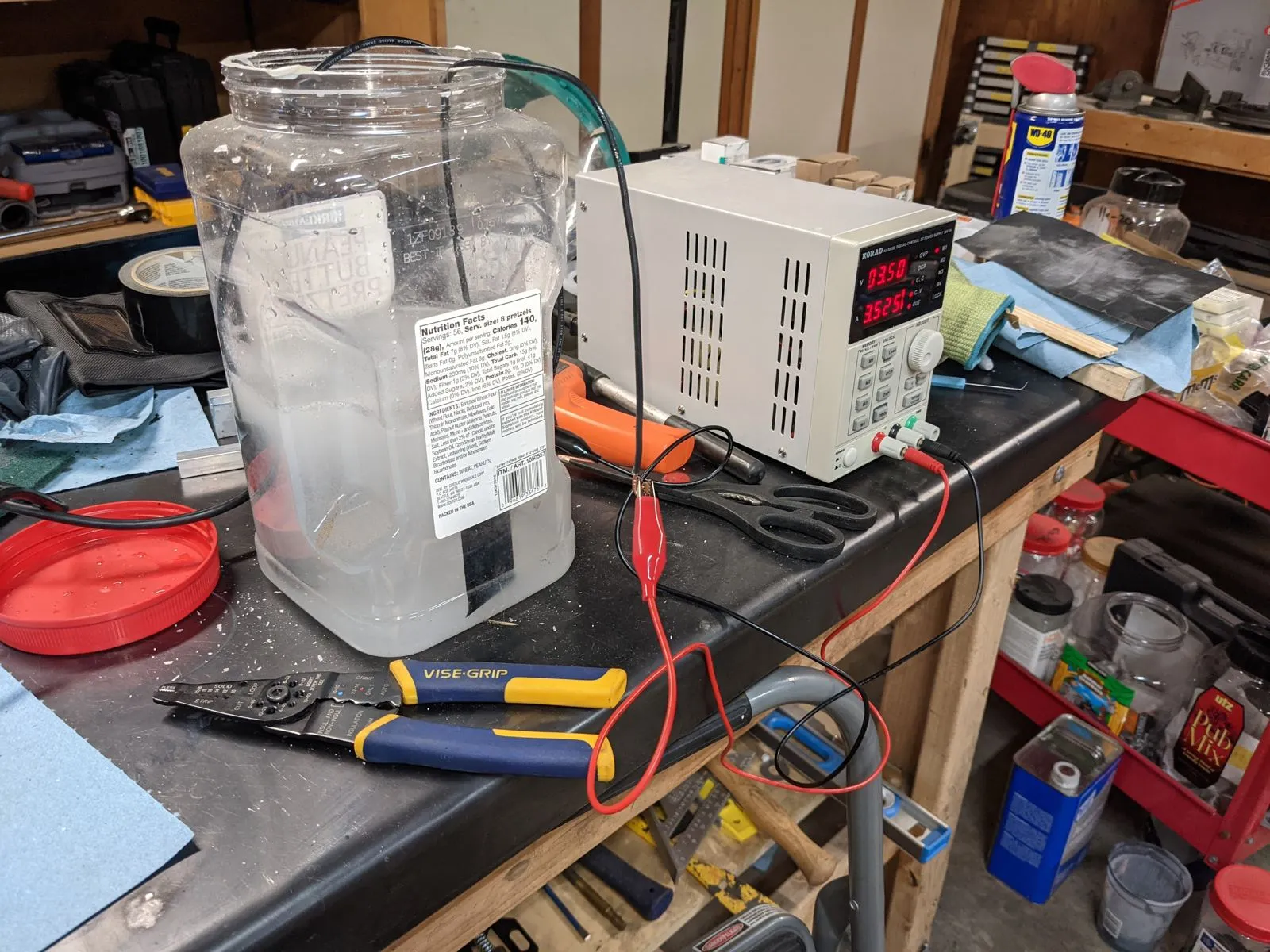 The aluminum name plate being etched in a homemade etching setup