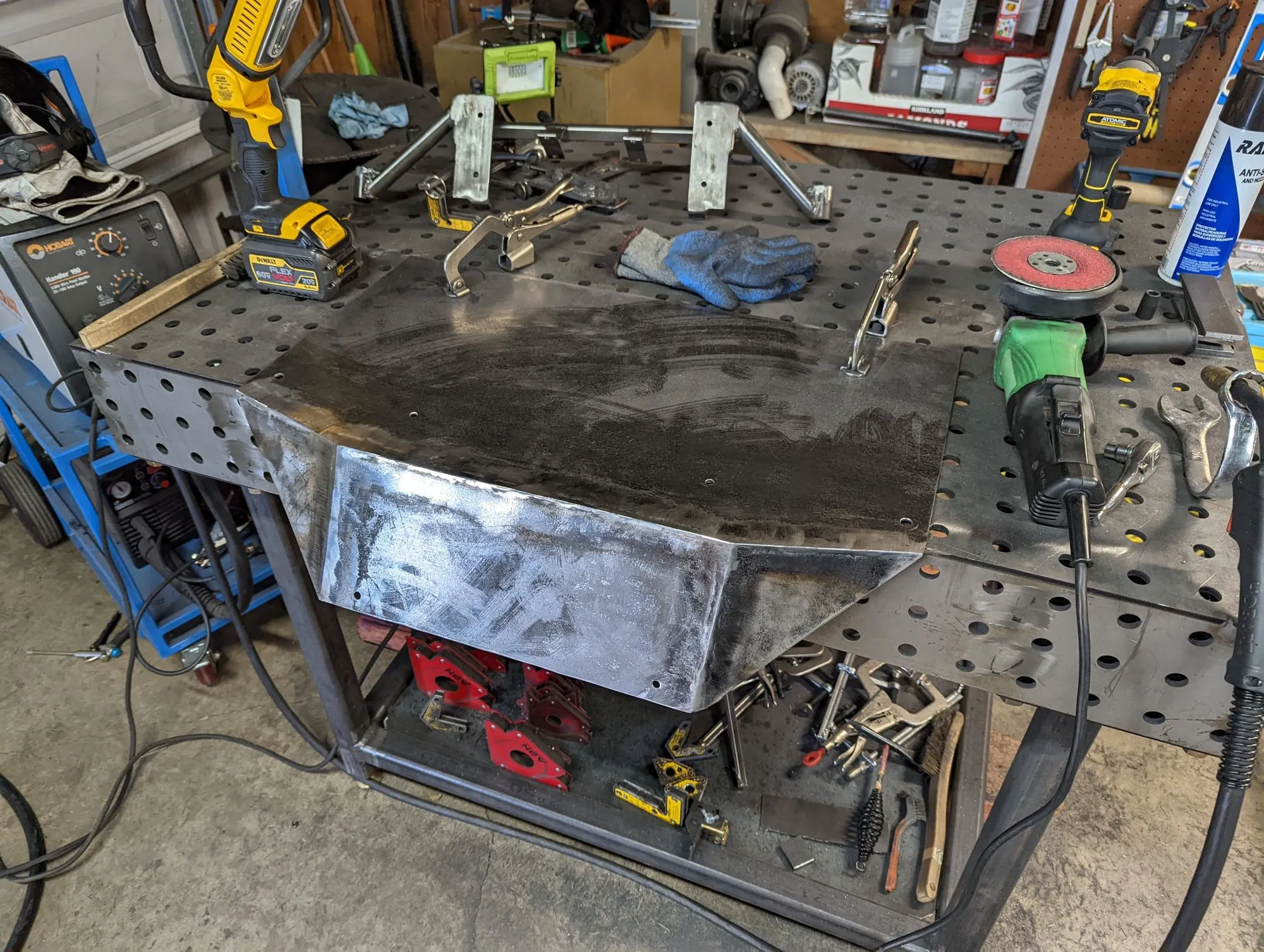 The onboard air tank skid plate and mount on the welding table during fabrication