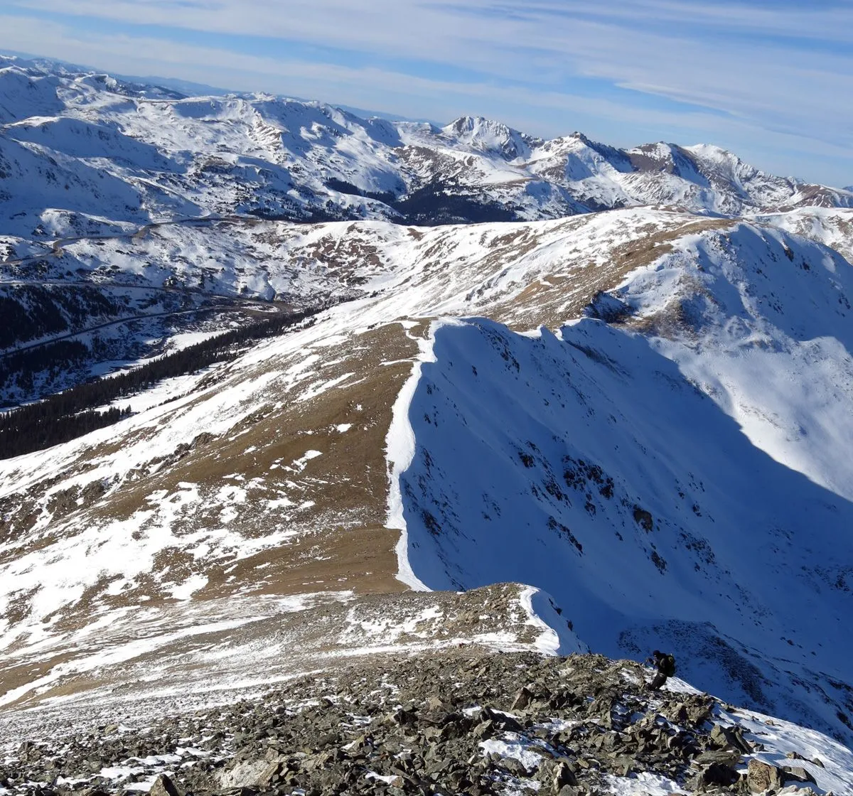 Descending a snowy ridge on Grays Peak in Colorado